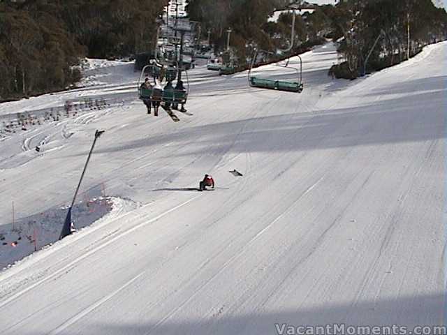 No names mentioned – ski patroller popping a ski under Kosi Express<br>in front of the first 4 chairs of the morning